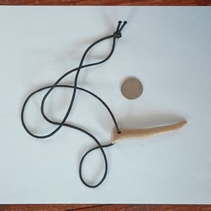 Genuine deer antler on a cord